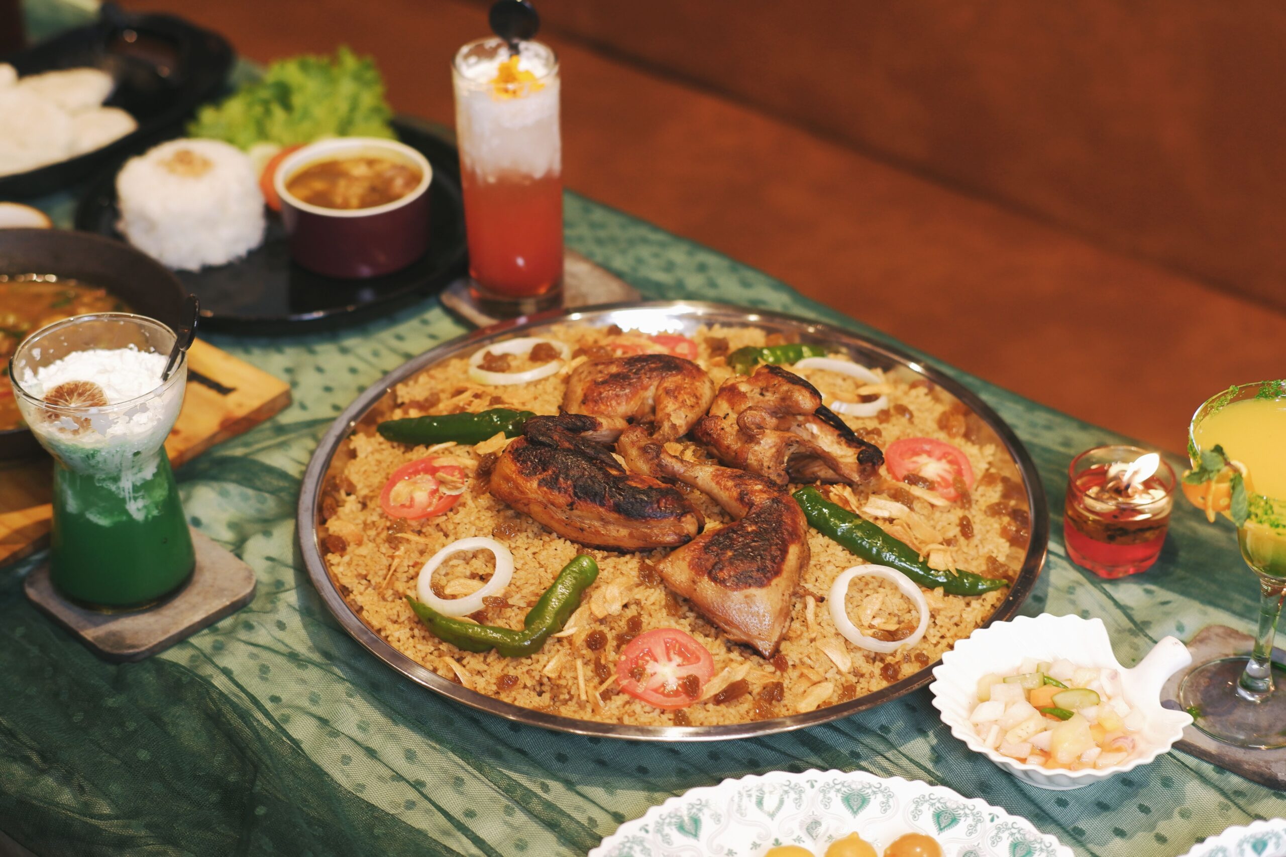pexels photo 36363479 36363479 A delicious spread of Indonesian biryani with grilled chicken and refreshing drinks, perfect for celebrations.